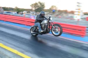 Jeremiah Cullen at the Harley Drag racer hops off the line during the Jim McClure All-Harley World Finals Oct. 27.