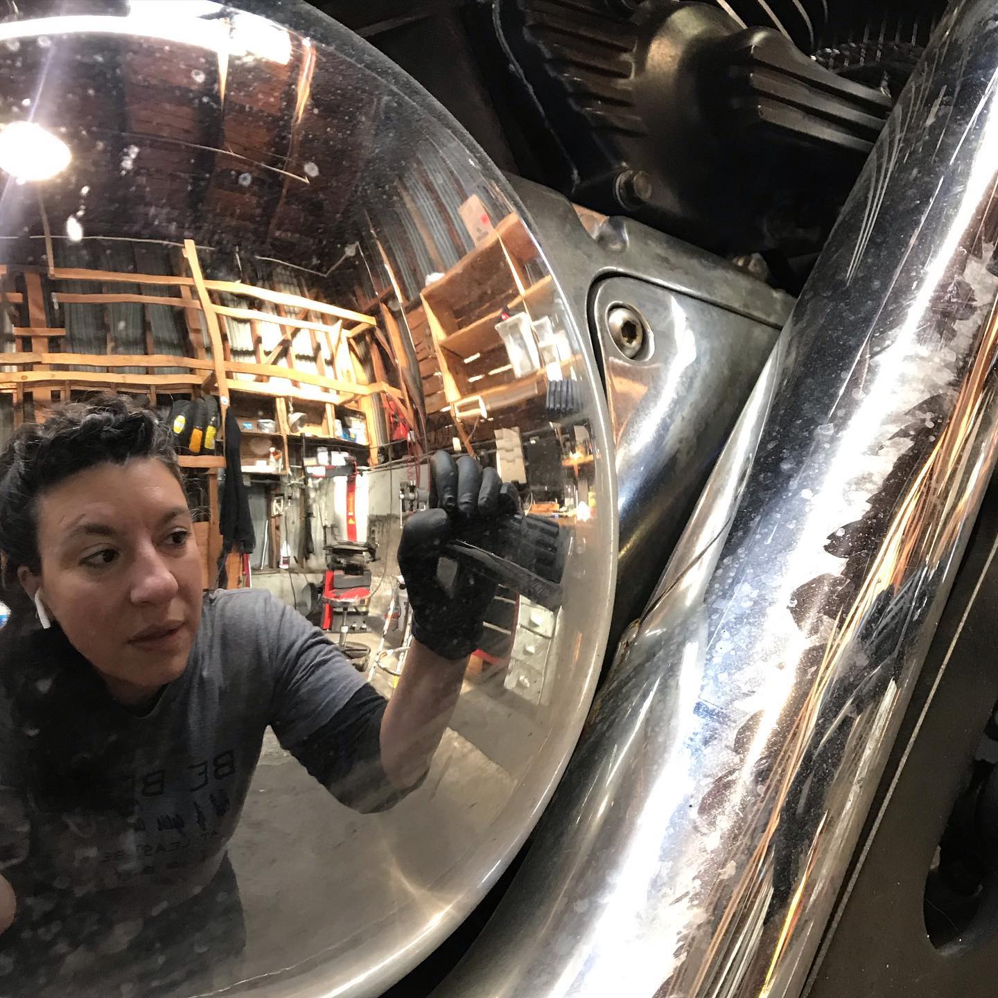 Lucy Carrera in her motorcycle repair shop, Moto Lucia.