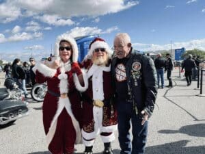 Marine Corps Veteran and retired police officer Paul Caputo poses with Santa during the annual Toys for Tots Run in Albuquerque, NM.