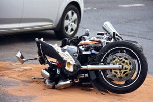 Photo of motorcycle on ground after crash