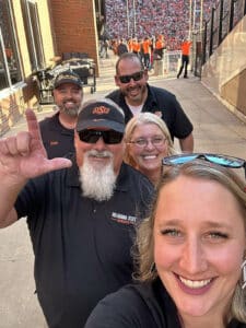 Photo of Law Tiger employees at the Bedlam Game in OK