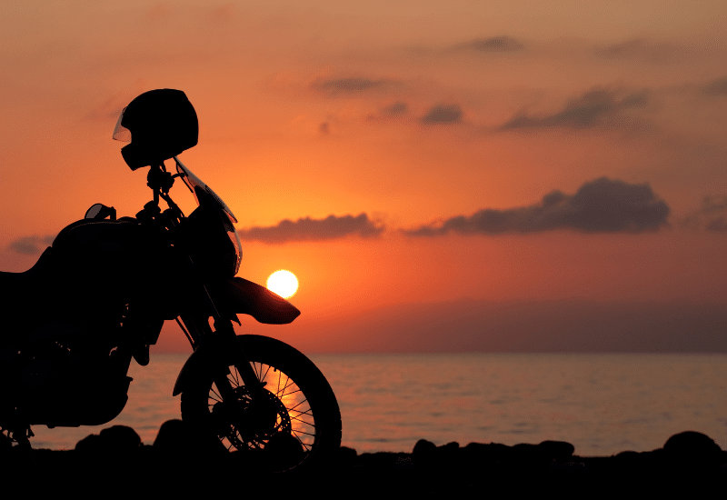 motorcycle silhouette in the sunset on san Diego scenic routes